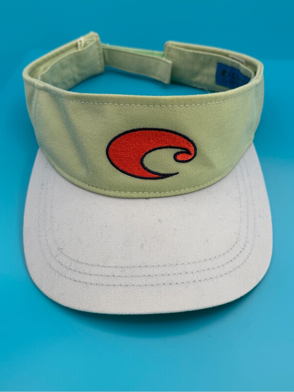 Costa Women’s Visor in Light Green, White with Orange Logo
